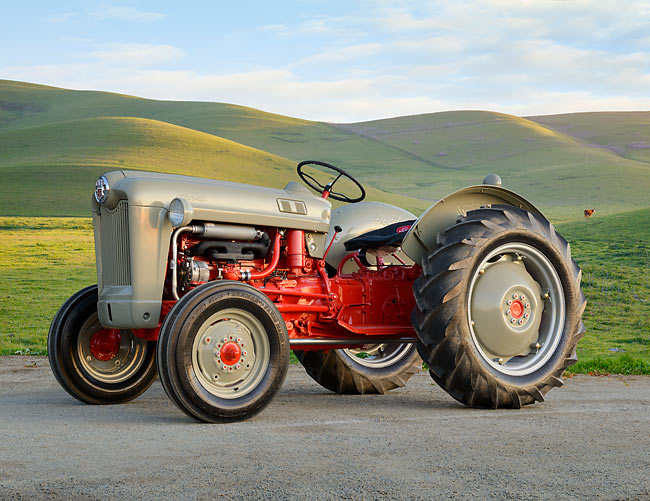 1960 Ford 600 Tractor Gray And Red 34 Side View On Pavement By Grassy